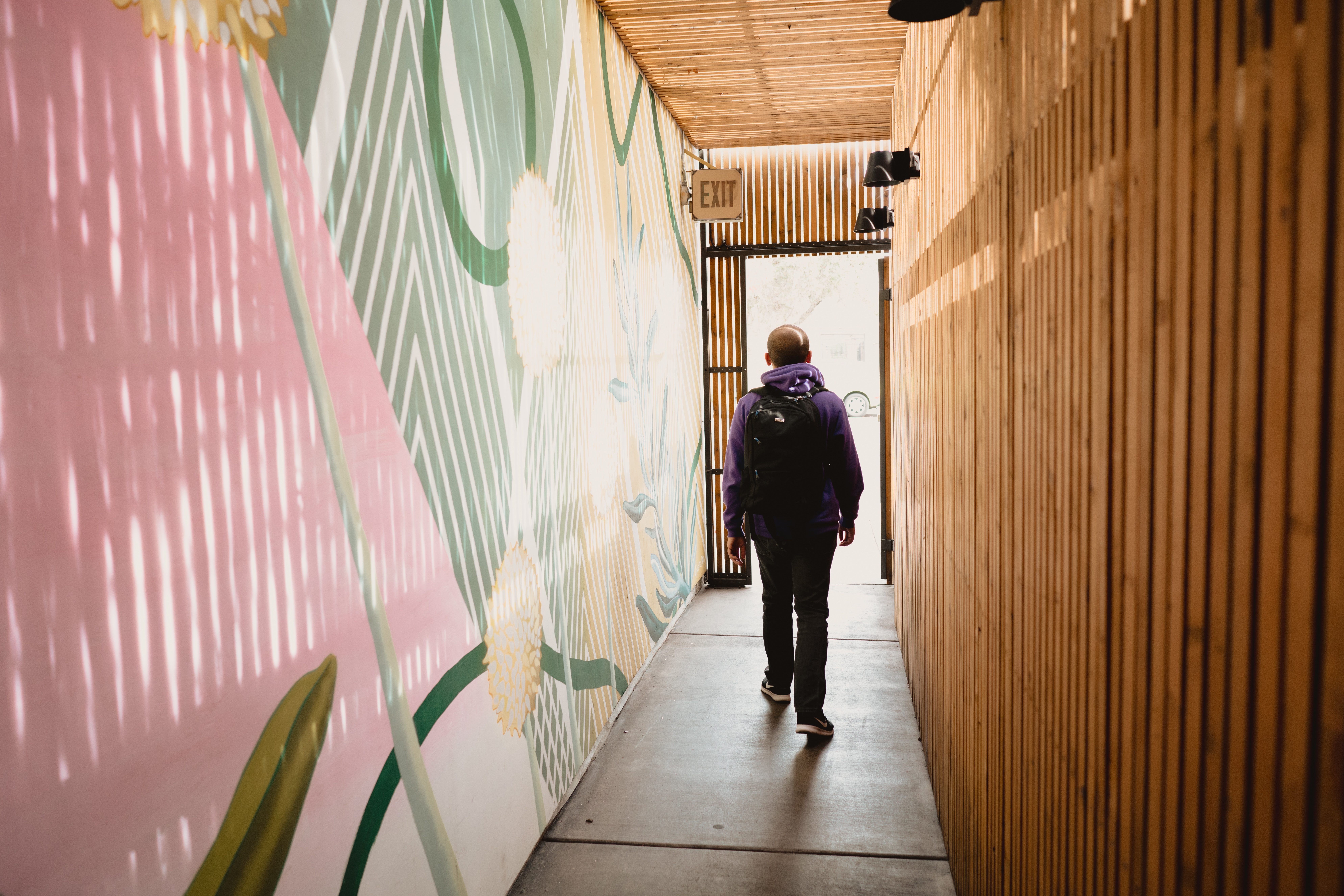 man-walking-through-pastel-bright-artistic-hipster-2023-11-27-05-16-33-utc