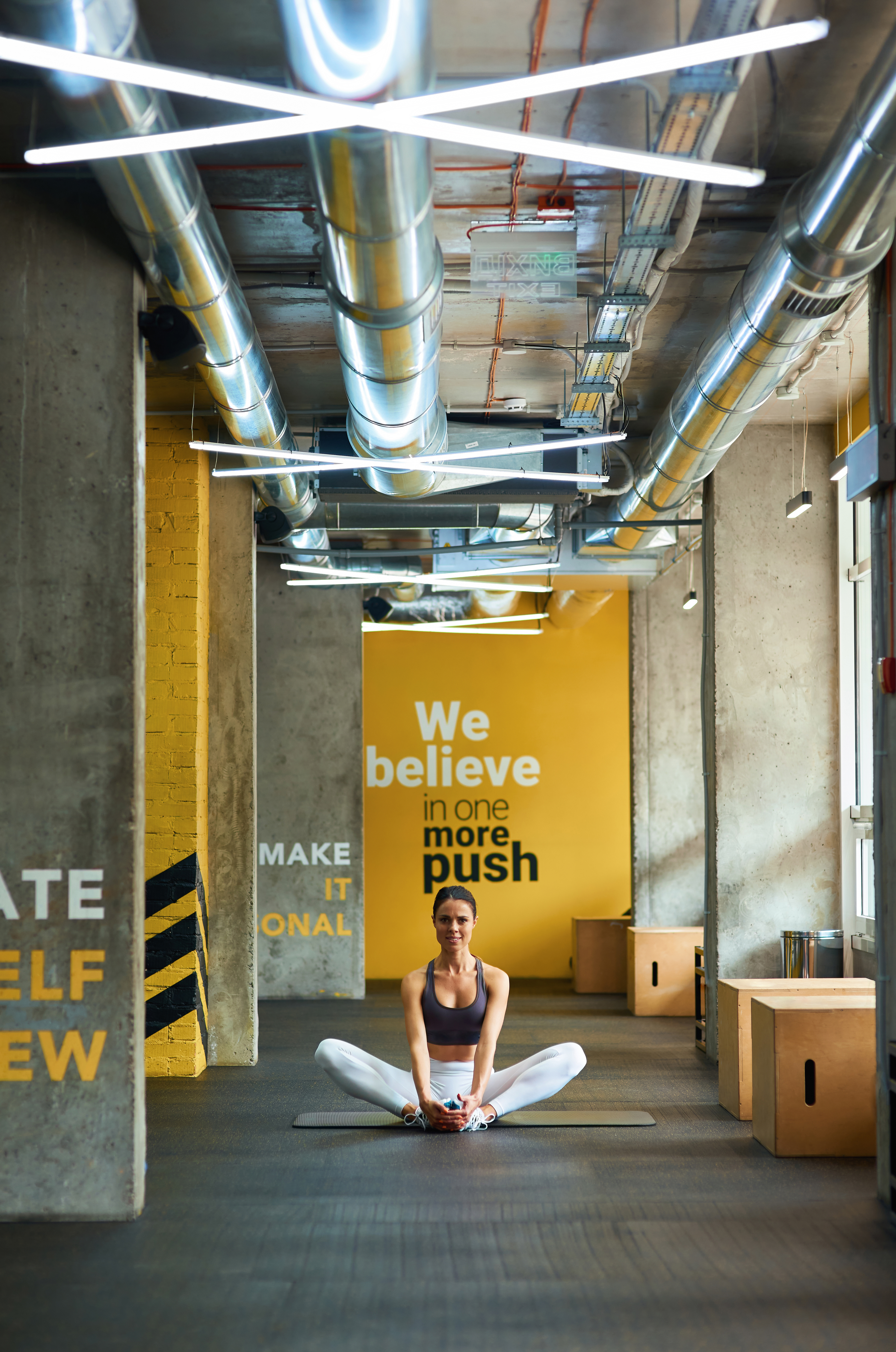 stretching-exercises-vertical-shot-of-a-young-fit-2023-11-27-05-26-20-utc